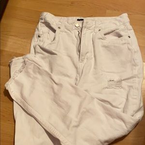 High-waisted white ripped jeans